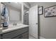The bathroom features a gray vanity with quartz countertop, stainless steel faucet, and tiled flooring at 528 Brycewood Dr, Burlington, NC 27215