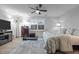 This bedroom features a treadmill, a television, neutral walls, carpet, and a ceiling fan at 528 Brycewood Dr, Burlington, NC 27215