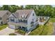 A beautiful two-story home with backyard pool, and a cozy front porch with outdoor seating at 528 Brycewood Dr, Burlington, NC 27215