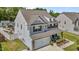 Charming home exterior with stone accents, a well-manicured lawn, and an attached garage at 528 Brycewood Dr, Burlington, NC 27215