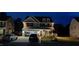 Charming two-story home with an attached garage and a well-manicured front yard in the evening at 528 Brycewood Dr, Burlington, NC 27215