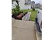 Landscaped walkway with decorative stones and mulch, complemented by lush greenery and a concrete driveway at 528 Brycewood Dr, Burlington, NC 27215