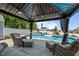 Relaxing gazebo overlooking the pool, complete with comfortable seating at 528 Brycewood Dr, Burlington, NC 27215