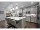 Spacious kitchen with island, stainless steel appliances, and hardwood floors at 528 Brycewood Dr, Burlington, NC 27215