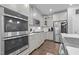 Modern kitchen featuring stainless steel appliances and gray cabinetry at 528 Brycewood Dr, Burlington, NC 27215