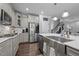 Well-equipped kitchen features stainless steel appliances, white cabinets, and a large farmhouse sink at 528 Brycewood Dr, Burlington, NC 27215