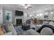 Cozy living room with fireplace, large windows, stylish furnishings, and open access to kitchen and dining at 528 Brycewood Dr, Burlington, NC 27215