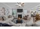 Comfortable living room features a fireplace, large windows, and stylish decor at 528 Brycewood Dr, Burlington, NC 27215