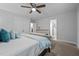 This well-lit main bedroom features neutral walls, plush carpet, and a charming dresser in the background at 528 Brycewood Dr, Burlington, NC 27215