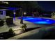 Backyard pool with an adjacent gazebo, lush landscaping and a playset in the background at 528 Brycewood Dr, Burlington, NC 27215