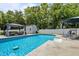 Backyard featuring a sparkling in-ground pool with patio furniture and lounge chairs at 528 Brycewood Dr, Burlington, NC 27215