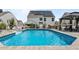 Backyard featuring a sparkling in-ground pool, gazebo, and solar panels at 528 Brycewood Dr, Burlington, NC 27215