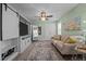 Cozy sitting room features custom entertainment center with sliding barn doors and plush furniture at 528 Brycewood Dr, Burlington, NC 27215
