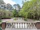 An expansive backyard with lush landscaping and elegant stone accents and water feature at 5420 Deer Forest Trl, Raleigh, NC 27614