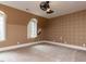 Carpeted bedroom featuring dormer windows, neutral walls, and modern fan and lighting fixture at 5420 Deer Forest Trl, Raleigh, NC 27614