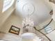 Grand foyer boasts a crystal chandelier, curved staircase and high ceilings at 5420 Deer Forest Trl, Raleigh, NC 27614