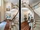 Elegant foyer features a spiral staircase, hardwood floors, and views of the living room at 5420 Deer Forest Trl, Raleigh, NC 27614