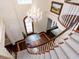 Stunning foyer with hardwood floors, grand staircase, and chandelier at 5420 Deer Forest Trl, Raleigh, NC 27614