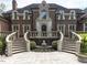 Grand entrance with stone steps, detailed stonework, and manicured landscaping at 5420 Deer Forest Trl, Raleigh, NC 27614