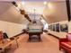 Spacious game room with a pool table, ping pong, and cozy seating area at 5420 Deer Forest Trl, Raleigh, NC 27614