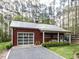 A large detached garage with a workshop area offers ample storage at 5420 Deer Forest Trl, Raleigh, NC 27614