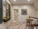 Upstairs hallway with brick floors, interior windows with shutters and sunflower decor at 5420 Deer Forest Trl, Raleigh, NC 27614