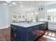 Open-concept kitchen features an expansive island with seating and abundant storage at 5420 Deer Forest Trl, Raleigh, NC 27614