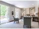 Inviting living room with doors to patio, neutral tones, and natural light at 5420 Deer Forest Trl, Raleigh, NC 27614