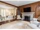 Open-concept living room with hardwood floors, fireplace, and a seamless flow at 5420 Deer Forest Trl, Raleigh, NC 27614