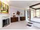 Spacious main bedroom features a raised bed, a fireplace, and large windows at 5420 Deer Forest Trl, Raleigh, NC 27614