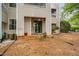 Backyard view featuring a patio, beige vinyl siding and small green bushes at 6001 Winterpointe Ln # 102, Raleigh, NC 27606