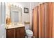 Standard bathroom with vanity, mirror, toilet and bathtub with shower curtain at 6001 Winterpointe Ln # 102, Raleigh, NC 27606