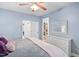 Comfortable bedroom with ceiling fan, dresser and view to closet at 6001 Winterpointe Ln # 102, Raleigh, NC 27606