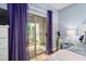 Bedroom with sliding glass door to patio area at 6001 Winterpointe Ln # 102, Raleigh, NC 27606
