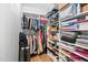 Organized walk-in closet with custom shelving, hanging racks, and ample storage space at 6001 Winterpointe Ln # 102, Raleigh, NC 27606