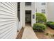 Ground floor entrance to condo with unit numbers and well-kept landscaping at 6001 Winterpointe Ln # 102, Raleigh, NC 27606