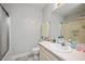 Functional bathroom with a shower, sink, and checkered floors at 604 Sinewell Dr, Wake Forest, NC 27587