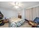 Relaxing bedroom featuring neutral walls, carpet, and a ceiling fan at 604 Sinewell Dr, Wake Forest, NC 27587