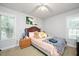Cozy bedroom with soft lighting, plush pillows, and neutral decor at 604 Sinewell Dr, Wake Forest, NC 27587