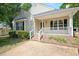 Charming single-story home featuring a cozy front porch and well-maintained landscaping at 604 Sinewell Dr, Wake Forest, NC 27587