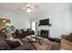 Inviting living room with vaulted ceilings, a fireplace, and stylish furnishings at 604 Sinewell Dr, Wake Forest, NC 27587