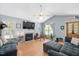 Spacious living room with a fireplace and large windows at 604 Sinewell Dr, Wake Forest, NC 27587
