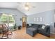 Bright living room featuring hardwood floors and ample seating at 604 Sinewell Dr, Wake Forest, NC 27587