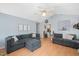 Open-concept living room with hardwood floors and neutral paint at 604 Sinewell Dr, Wake Forest, NC 27587