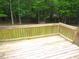 Wooden deck and railing offering an outdoor seating area with a view at 6673 Nc 96 W Hwy, Youngsville, NC 27596