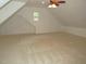 Large bonus room featuring neutral carpeting, a ceiling fan, and great window for natural light and ventilation at 6673 Nc 96 W Hwy, Youngsville, NC 27596