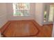 Dining room with hardwood floors and elegant wainscoting at 6673 Nc 96 W Hwy, Youngsville, NC 27596
