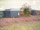 Home exterior with AC units near some rose bushes at 6673 Nc 96 W Hwy, Youngsville, NC 27596