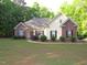 Charming home with brick and vinyl siding, manicured landscaping, and inviting curb appeal at 6673 Nc 96 W Hwy, Youngsville, NC 27596