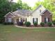 Charming one-story home with brick and vinyl siding and manicured front yard at 6673 Nc 96 W Hwy, Youngsville, NC 27596